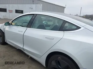 2018 Tesla Model 3 Long Range Battery with VIN 5YJ3E1EB4JF086012, listed as a IAAI auction lot 41683859 with 52,059 mi miles and . Bid and sale history available at DreamBid. Image 14.