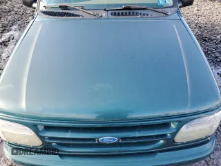 1997 Ford Explorer XL z VIN 1FMDU34E2VZA14008, wystawiony jako Copart lot #43590605 z przebiegiem 185 995 mil mil oraz Szkoda całkowita • Salvage title. Historia ofert i sprzedaży dostępna na DreamBid. Obrazek 12.