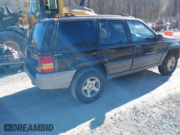 1996 Jeep Grand Cherokee Laredo with VIN 1J4GZ58S3TC345107, listed as a IAAI auction lot 41661884 with 179,175 mi miles. Bid and sale history available at carsss.com. Image 4.