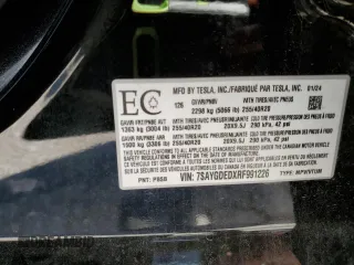 2024 Tesla Model Y z VIN 7SAYGDEDXRF991226, wystawiony jako Copart lot #62090255 z przebiegiem 42 853 mil mil oraz Szkoda całkowita • Salvage title. Historia ofert i sprzedaży dostępna na DreamBid. Obrazek 13.