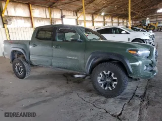 2022 Toyota Tacoma 4WD SR with VIN 3TYCZ5AN0NT055986, listed as a Copart auction lot 50165995 with 52,628 mi miles and Salvage Title. Bid and sale history available at carsss.com. Image 4.