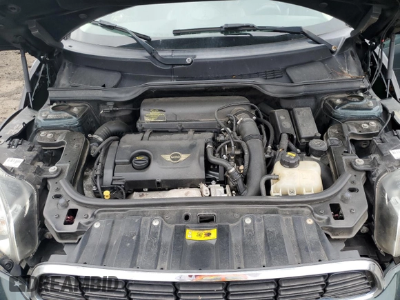 2014 MINI Countryman S with VIN WMWZC5C58EWP39797, listed as a Copart auction lot 62193515 with 84,989 mi miles and Salvage title. Bid and sale history available at DreamBid. Image 11.