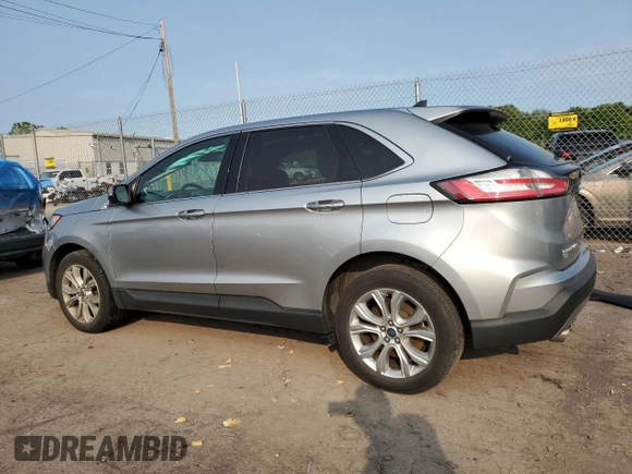 2021 Ford Edge Titanium with VIN 2FMPK4K91MBA12380, listed as a Copart auction lot 59275785 with 82,295 mi miles and Salvage title. Bid and sale history available at DreamBid. Image 2.