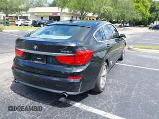 2011 BMW 5 Series GT 535i xDrive with VIN WBASP2C50BC337015, listed as a IAAI auction lot 42209500 with 136,961 mi miles. Bid and sale history available at carsss.com. Image 4.