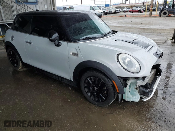 2014 MINI Hardtop S with VIN WMWXM7C57ET985421, listed as a Copart auction lot 49443335 with 76,168 mi miles and Salvage Title. Bid and sale history available at DreamBid. Image 4.