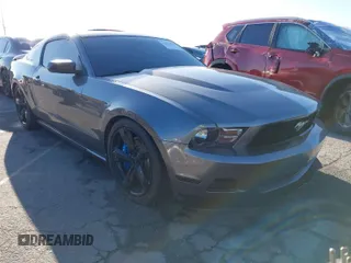 2012 Ford Mustang V6 Premium with VIN 1ZVBP8AM4C5285813, listed as a IAAI auction lot 41818425 with 128,338 mi miles. Bid and sale history available at carsss.com. Image 1.