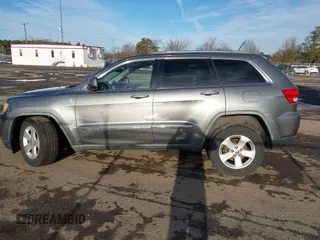 2011 Jeep Grand Cherokee 70th Anniversary with VIN 1J4RR4GT6BC715848, listed as a IAAI auction lot 41562152 with 119,910 mi miles. Bid and sale history available at carsss.com. Image 14.