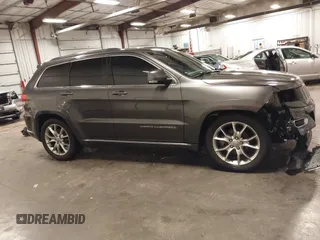2015 Jeep Grand Cherokee Summit with VIN 1C4RJFJG4FC634129, listed as a IAAI auction lot 42481877 with 149,087 mi miles and . Bid and sale history available at DreamBid. Image 14.