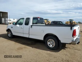 1999 Ford F-150 with VIN 2FTRX17L0XCA37979, listed as a Copart auction lot 58216695 with 256,055 mi miles and Clean title. Bid and sale history available at DreamBid. Image 2.