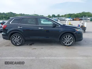 2015 Mazda CX-9 Grand Touring z VIN JM3TB2DA1F0456773, wystawiony jako IAAI lot #42257555 z przebiegiem 152 890 mil mil oraz . Historia ofert i sprzedaży dostępna na DreamBid. Obrazek 13.
