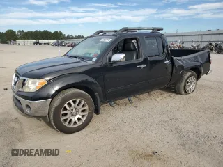 2009 Nissan Frontier LE with VIN 1N6AD09UX9C410943, listed as a Copart auction lot 74891774 with 136,405 mi miles and Salvage title. Bid and sale history available at DreamBid. Image 1.
