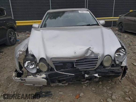 2001 Mercedes-Benz E-Class with VIN WDBJF65J71B201020, listed as a Copart auction lot 76067154 with 328,629 mi miles and Salvage Title. Bid and sale history available at carsss.com. Image 5.