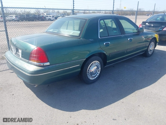 2000 Ford Crown Victoria with VIN 2FAFP73W9YX117108, listed as a IAAI auction lot 41713328 with 83,018 mi miles. Bid and sale history available at carsss.com. Image 4.