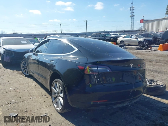 2020 Tesla Model 3 Standard Range Plus with VIN 5YJ3E1EA0LF660759, listed as a IAAI auction lot 41505250 with 63,322 mi miles and . Bid and sale history available at DreamBid. Image 3.