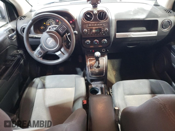 2016 Jeep Compass Sport with VIN 1C4NJCBA1GD512864, listed as a Copart auction lot 56297115 with 216,693 mi miles and Salvage title. Bid and sale history available at DreamBid. Image 8.