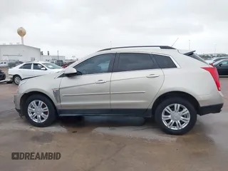 2015 Cadillac SRX z VIN 3GYFNAE37FS597695, wystawiony jako IAAI lot #42184666 z przebiegiem 106 210 mil mil oraz . Historia ofert i sprzedaży dostępna na DreamBid. Obrazek 14.