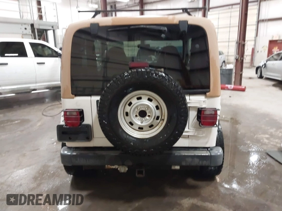 1997 Jeep Wrangler Sahara with VIN 1J4FY49S3VP529837, listed as a IAAI auction lot 41752978 with 138,024 mi miles. Bid and sale history available at carsss.com. Image 16.