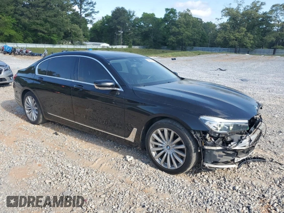 2017 BMW 7 Series 740i with VIN WBA7E2C57HG739482, listed as a Copart auction lot 53652145 with 102,418 mi miles and Salvage title. Bid and sale history available at DreamBid. Image 4.