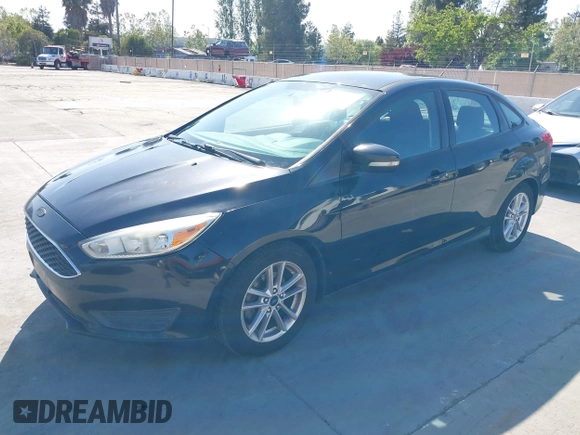 2015 Ford Focus SE with VIN 1FADP3F23FL313614, listed as a IAAI auction lot 42153320 with 121,346 mi miles. Bid and sale history available at carsss.com. Image 2.