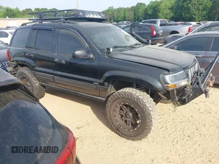 2004 Jeep Grand Cherokee Laredo with VIN 1J4GW48J34C279623, listed as a IAAI auction lot 42162261 with 144,619 mi miles and . Bid and sale history available at DreamBid. Image 1.