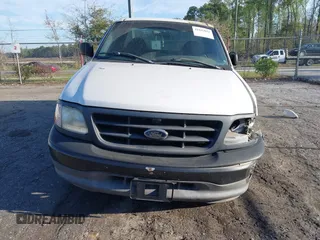 2002 Ford F-150 XL z VIN 1FTRF17L22NB18648, wystawiony jako IAAI lot #41843041 z przebiegiem 90 033 mil mil oraz . Historia ofert i sprzedaży dostępna na DreamBid. Obrazek 13.