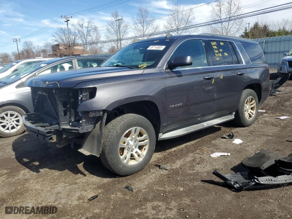 2015 Chevrolet Tahoe LS with VIN 1GNSKAKC2FR252599, listed as a Copart auction lot 48714885 with 140,946 mi miles and Salvage Title. Bid and sale history available at carsss.com. Image 1.