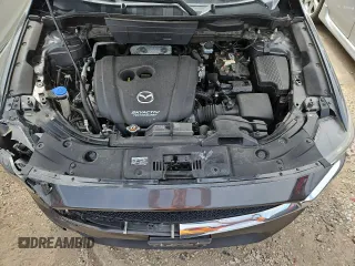2018 Mazda CX-5 Touring z VIN JM3KFBCM4J0349687, wystawiony jako Copart lot #55857945 z przebiegiem Nie podano mil oraz Szkoda całkowita • Salvage title. Historia ofert i sprzedaży dostępna na DreamBid. Obrazek 12.