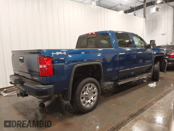 2015 GMC Sierra 2500HD Denali z VIN 1GT120E86FF655301, wystawiony jako IAAI lot #41965001 z przebiegiem 74 136 mil mil oraz . Historia ofert i sprzedaży dostępna na DreamBid. Obrazek 4.
