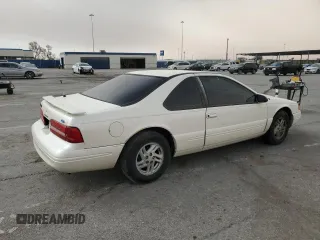 1997 Ford Thunderbird LX with VIN 1FALP62W5VH124101, listed as a Copart auction lot 47547695 with 148,828 mi miles and Salvage Title. Bid and sale history available at carsss.com. Image 3.