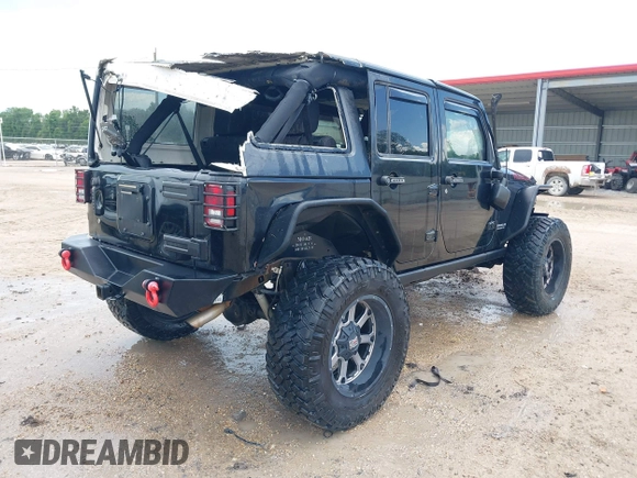 2015 Jeep Wrangler Unlimited Rubicon Hard Rock with VIN 1C4HJWFG0FL674700, listed as a IAAI auction lot 42511949 with 138,370 mi miles and . Bid and sale history available at DreamBid. Image 4.