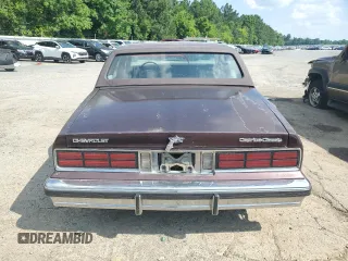 1987 Chevrolet Caprice z VIN 1G1BU51H7H9156079, wystawiony jako Copart lot #60443124 z przebiegiem 44 452 mil mil oraz Szkoda całkowita • Salvage title. Historia ofert i sprzedaży dostępna na DreamBid. Obrazek 6.