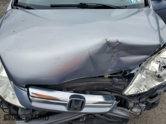 2007 Honda CR-V EX z VIN JHLRE48507C054572, wystawiony jako Copart lot #59772665 z przebiegiem 254 212 mil mil oraz Szkoda całkowita • Salvage title. Historia ofert i sprzedaży dostępna na DreamBid. Obrazek 12.
