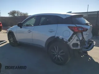 2018 Mazda CX-3 Touring with VIN JM1DKDC77J0305749, listed as a Copart auction lot 86524474 with 112,562 mi miles and Salvage Title. Bid and sale history available at DreamBid. Image 2.