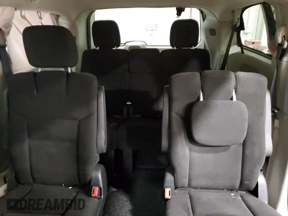 2014 Dodge Grand Caravan SXT z VIN 2C4RDGCG2ER239110, wystawiony jako Copart lot #57247855 z przebiegiem 94 126 mil mil oraz Nie do naprawy. Historia ofert i sprzedaży dostępna na DreamBid. Obrazek 10.