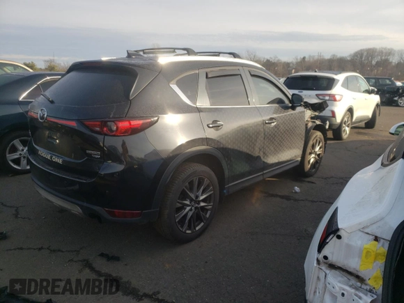 2021 Mazda CX-5 Signature with VIN JM3KFBEY2M0345187, listed as a Copart auction lot 82786984 with 98,014 mi miles and Salvage Title. Bid and sale history available at carsss.com. Image 3.