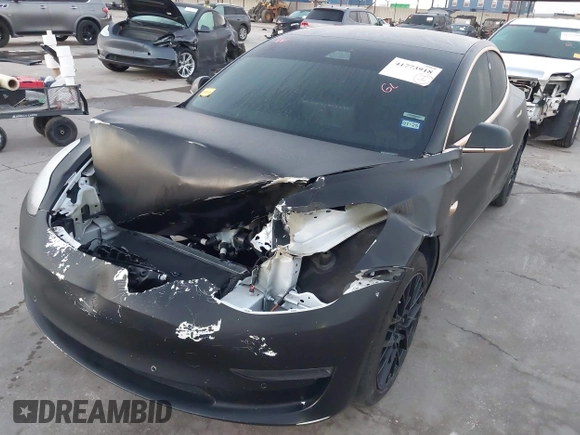 2020 Tesla Model 3 Standard Range Plus with VIN 5YJ3E1EA0LF597761, listed as a IAAI auction lot 41773918 with 89,957 mi miles. Bid and sale history available at carsss.com. Image 6.