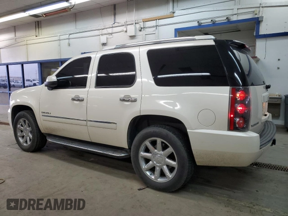 2014 GMC Yukon Denali with VIN 1GKS2EEF6ER141112, listed as a Copart auction lot 88526685 with 142,248 mi miles and Salvage Title. Bid and sale history available at carsss.com. Image 2.