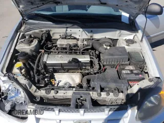 2005 Hyundai Accent GLS with VIN KMHCG45C55U623340, listed as a Copart auction lot 59587304 with 275,364 mi miles and Salvage Title. Bid and sale history available at carsss.com. Image 13.