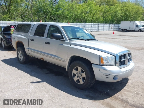 2005 Dodge Dakota SLT with VIN 1D7HW48N45S321002, listed as a IAAI auction lot 42240338 with 214,983 mi miles and . Bid and sale history available at DreamBid. Image 1.