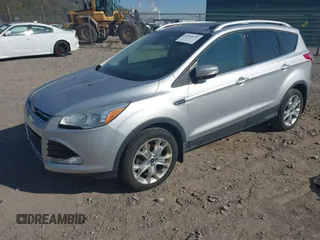2016 Ford Escape Titanium with VIN 1FMCU9JX2GUA50916, listed as a IAAI auction lot 42118711 with 121,405 mi miles. Bid and sale history available at carsss.com. Image 2.