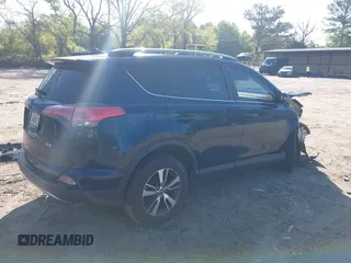 2018 Toyota RAV4 XLE with VIN JTMWFREV5JJ739619, listed as a IAAI auction lot 42017343 with 126,810 mi miles and . Bid and sale history available at DreamBid. Image 4.