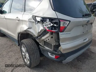 2018 Ford Escape SE z VIN 1FMCU9GD1JUB02119, wystawiony jako IAAI lot #42092393 z przebiegiem 69 309 mil mil oraz . Historia ofert i sprzedaży dostępna na DreamBid. Obrazek 18.
