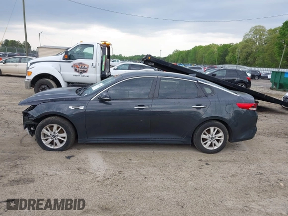 2016 Kia Optima LX with VIN 5XXGT4L38GG023697, listed as a IAAI auction lot 41976461 with 131,023 mi miles. Bid and sale history available at carsss.com. Image 14.