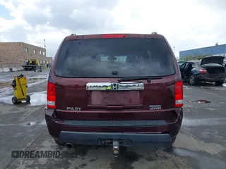 2009 Honda Pilot Touring with VIN 5FNYF48959B007813, listed as a IAAI auction lot 41823645 with 200,571 mi miles and . Bid and sale history available at carsss.com. Image 16.