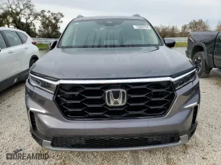 2025 Honda Pilot Touring with VIN 5FNYG2H75SB002553, listed as a Copart auction lot 76869764 with 7,426 mi miles and Salvage Title. Bid and sale history available at carsss.com. Image 5.