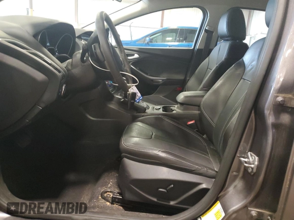 2014 Ford Focus Titanium z VIN 1FADP3N27EL462950, wystawiony jako Copart lot #65207155 z przebiegiem 34 058 mil mil oraz Szkoda całkowita • Salvage title. Historia ofert i sprzedaży dostępna na DreamBid. Obrazek 7.