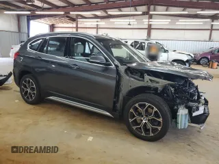 2021 BMW X1 xDrive28i with VIN WBXJG9C00M5S35249, listed as a Copart auction lot 61895775 with 34,641 mi miles and Salvage title. Bid and sale history available at DreamBid. Image 4.