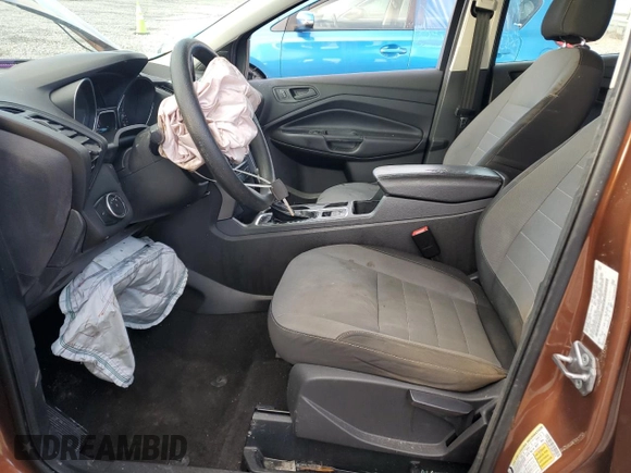 2017 Ford Escape S with VIN 1FMCU0F79HUE12519, listed as a Copart auction lot 86373094 with 144,446 mi miles and Salvage title. Bid and sale history available at DreamBid. Image 7.