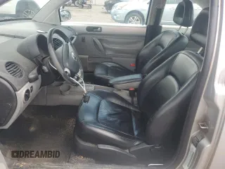 2001 Volkswagen Beetle GLX with VIN 3VWDD21C21M406898, listed as a Copart auction lot 55597675 with 104,597 mi miles and Salvage Title. Bid and sale history available at DreamBid. Image 7.