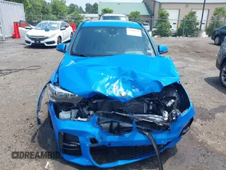 2021 BMW X1 xDrive28i with VIN WBXJG9C04M5T61811, listed as a IAAI auction lot 42509852 with 30,400 mi miles and . Bid and sale history available at DreamBid. Image 12.